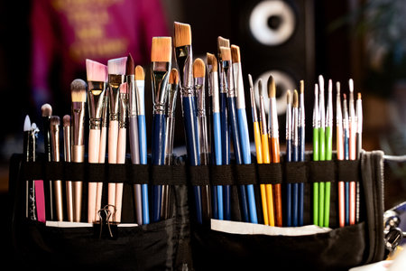 Various brushes for drawing on a dark blurred backgroundの写真素材