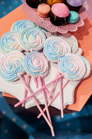 colorful round candies on sticksの写真素材