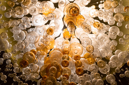 round lamps on long cords, conceptual chandelierの写真素材