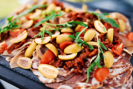 close-up delicacy - bacon with olives and sun-dried tomatoesの写真素材