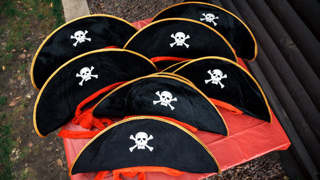 a lot of children's pirate hats