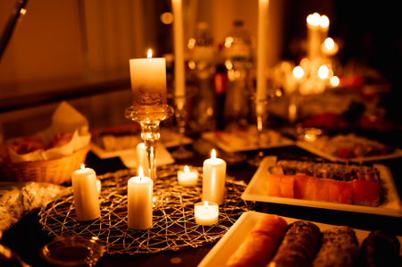 table with burning candles and foodの写真素材