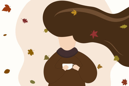 abstract girl with long hair in a sweater, with a cup of tea or coffee in autumn leavesの写真素材