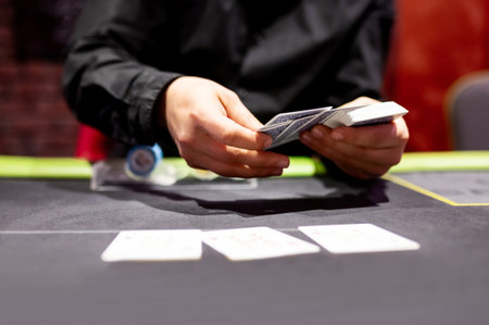 Dealer's hands throw playing cards on the table