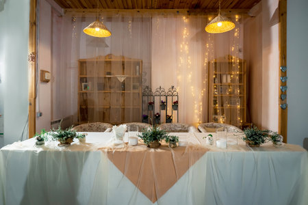 Decorated table for newlyweds with flowersの写真素材