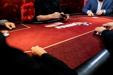 top view of men and women playing poker in casinoの写真素材