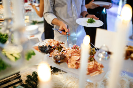 plate with meat, salami, ham, backon, prosciutto on Dark gray black slate backgroundの写真素材