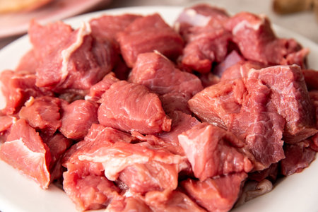 fresh raw sliced meat on a white plateの写真素材