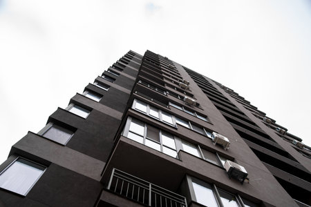 Multi-storey residential buildings and sky, city districtの写真素材