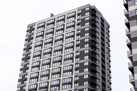 Multi-storey residential buildings and sky, city districtの写真素材