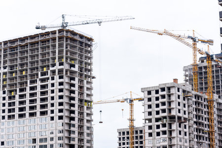 Crane tower at the construction site of a multi-storey residential building. building conceptの写真素材