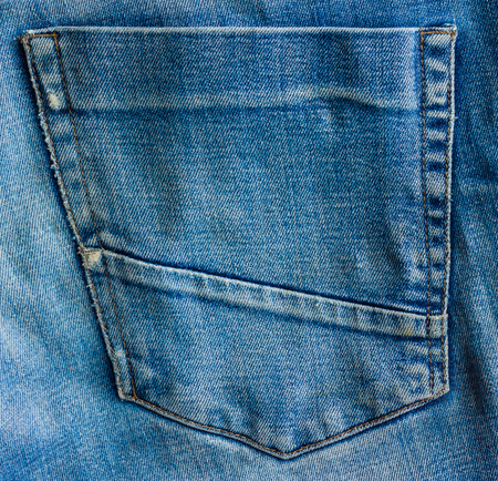 Shabby back pocket. Back pocket close-up of denim.の写真素材