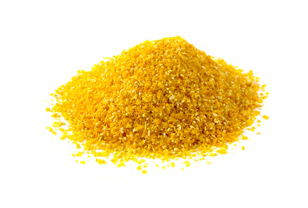 Pile of corn cereal on a white background. Corn cereals close-up isolated on white background.の写真素材