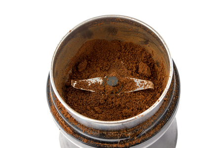 Electric coffee grinder close-up. Ground coffee in an electric coffee grinder.の写真素材
