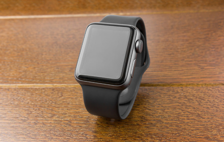 February 2018. Apple Watch Series 3 on a wooden table. A new watch from the APPLE company, close-up on a wooden surface.のeditorial素材