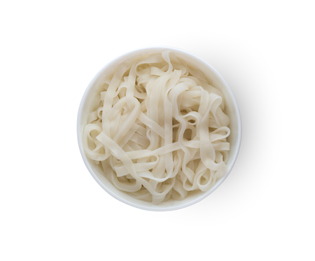 Rice noodles in a plate. Boiled rice noodles in a plate on a white background.Top viewの写真素材