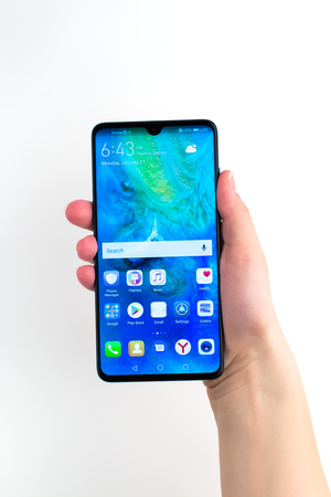Rostov-on-Don, Russia - January 2019. Huawei Mate 20 Midnight Blue. A new smartphone from the company Huawei in hand on a white background.のeditorial素材