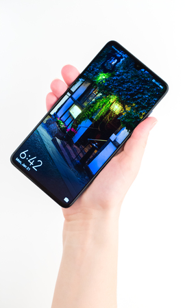 Rostov-on-Don, Russia - January 2019. Huawei Mate 20 Midnight Blue. A new smartphone from the company Huawei in hand on a white background.のeditorial素材