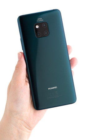 Rostov-on-Don, Russia - February 2019. HUAWEI Mate 20 Pro on a white background. The new smartphone from the company HUAWEI in hand on a white background.のeditorial素材