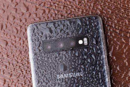 Rostov-on-Don, Russia - March 2019. Samsung Galaxy S10 on a wooden surface.The new Samsung...