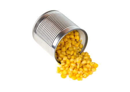 Canned corn on a white background. Corn closeup in an iron jar on a white background.の写真素材