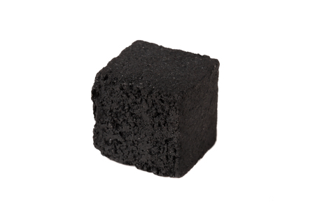 Coconut charcoal on a white background. Coconut coal cubes for hookah close-up.の写真素材
