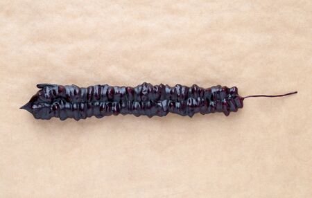 Churchkhela on parchment paper. Georgian sweet close-up.