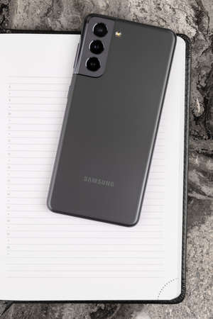 Rostov-on-Don, Russia - February 2021. Samsung Galaxy S21 on a marble table. A new smartphone from...