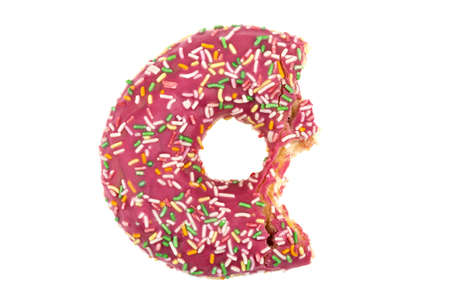 Donut close-up on a white background. Bitten donut isolated on white background.の写真素材