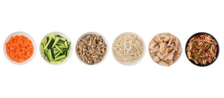 Asian wok noodles on white background. Wok noodles close-up, top view. A set of products for making wok noodles.の写真素材