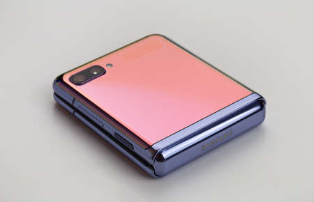 Rostov-on-Don, Russia - May 2021. Samsung Galaxy Z Flip on a gray background. New smartphone with a...