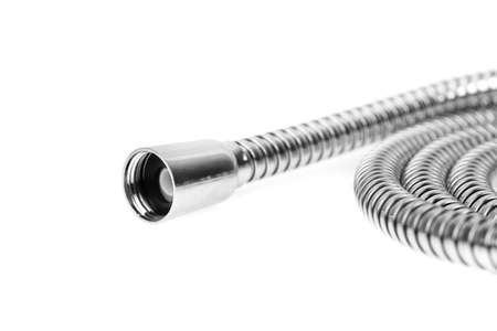 Shower hose on a white background. Silver shower hose close-up.の写真素材