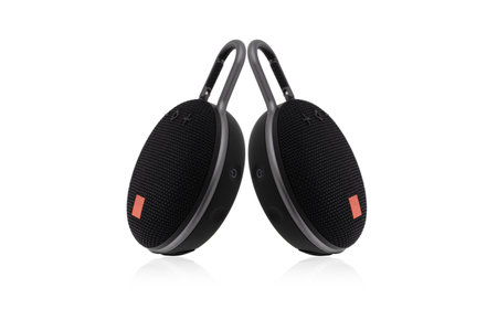 Wireless speaker on a white background. Round music speaker close-up.の写真素材