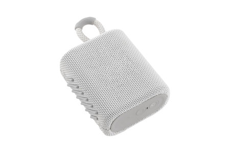 Wireless speaker on a white background. Round music speaker close-up.の写真素材