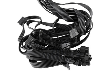 Connection wires from the power supply of a personal computer on a white background. Wires with...