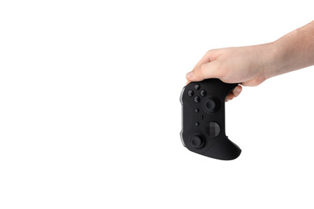 Joystick in hand on a white background. Gamepad in hand closeup isolated on white background.の写真素材