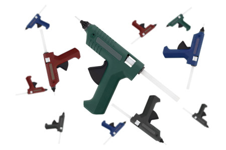 Glue gun on a white background. Electric glue gun close-up on a white backgroundの写真素材