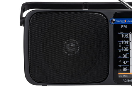 Radio receiver on a white background. Black portable wireless radio close-up isolated on a white background.の写真素材
