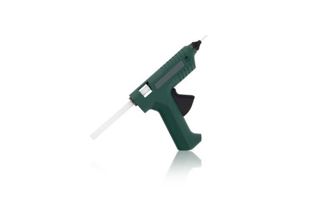 Glue gun on a white background. Electric glue gun close-up on a white backgroundの写真素材