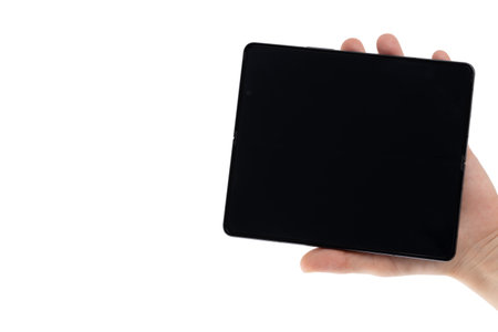 Shenzhen, China - January 2023.Samsung Galaxy Z Fold 4 on white background. New smartphone in hand from the company Samsung close-up isolated on a white background.のeditorial素材