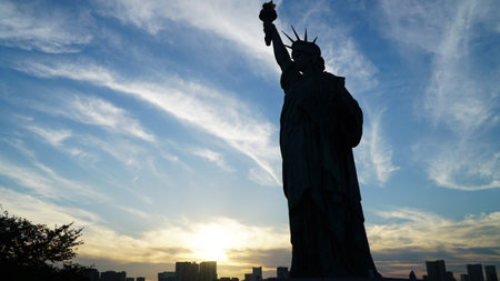 Statue of Liberty Silhouette at Sunsetの写真素材