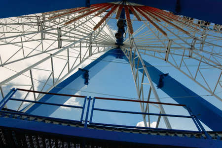 Ferris wheel from within on clouds and sky backgroundの写真素材