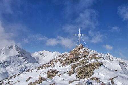 Frozen cross on the peakの写真素材