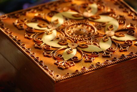 Red Wooden casket with a pattern from a copper wire.の写真素材