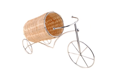 Support under a bottle with wine in the form of a bicycle with the wattled container.の写真素材