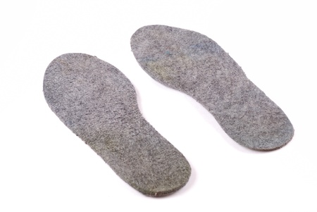 Warm grey woollen insoles for footwear. Convenience of a foot a foot.