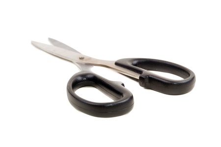 Close up and isolated shot of modern sharp scissors against white