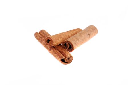 Two cinnamon sticks isolated on white background. Close up.