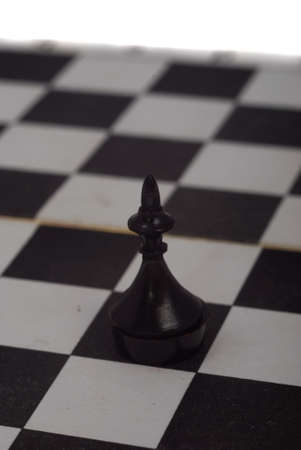 Chess figures on board isolated on whiteの写真素材