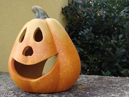 Orange Halloween pumkin in front the house as holidays decoration.の写真素材